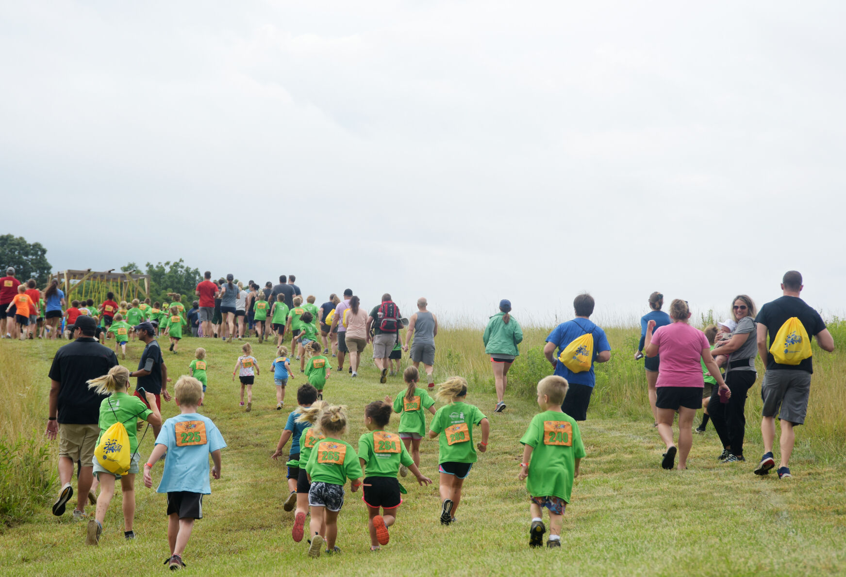 Children and their parents head toward